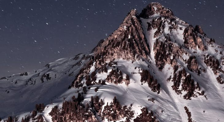 Shooting stars in snowy rock mountain rock in Les Arcs 