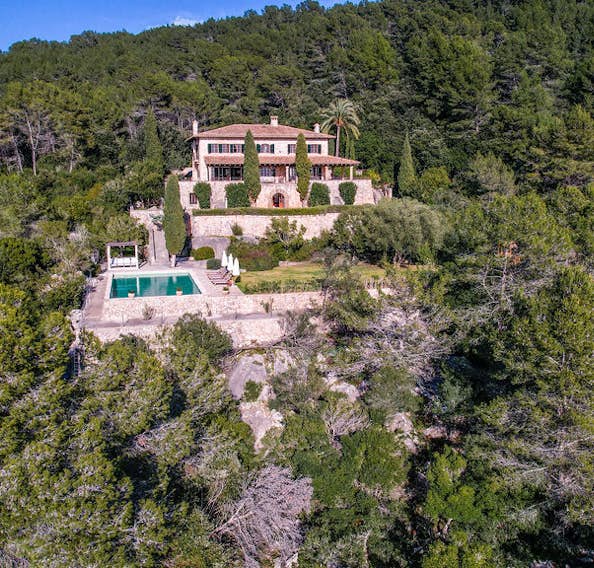 Majorque location - Can Tramuntana - An aerial view of the villa surrounded by trees.