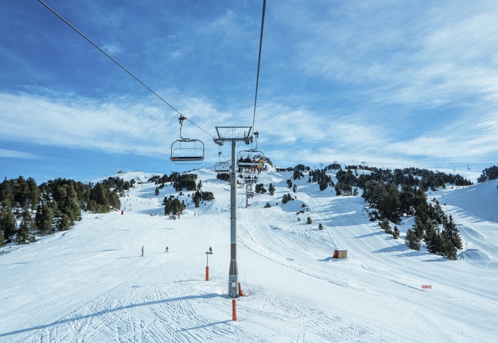 Long ski slopes and lifts in mountain background in Les Arcs