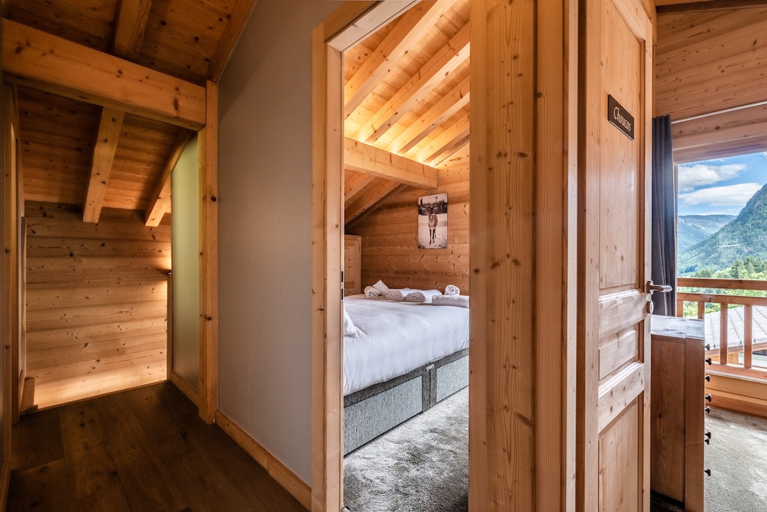 Cosy wooden double bedroom landscape views hotel services chalet Balata Morzine