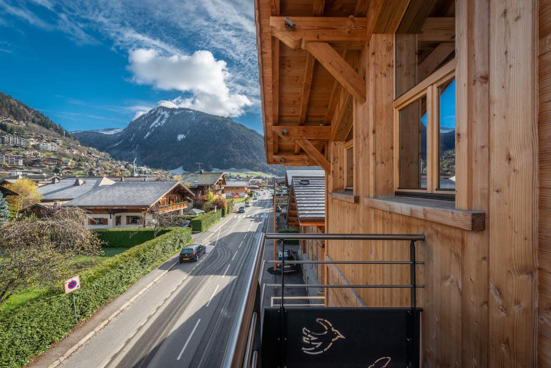 Morzine accommodation - Apartment Flocon - A wooden terrace with mountain views over the Alps at the luxury hotel services apartment Flocon in Morzine