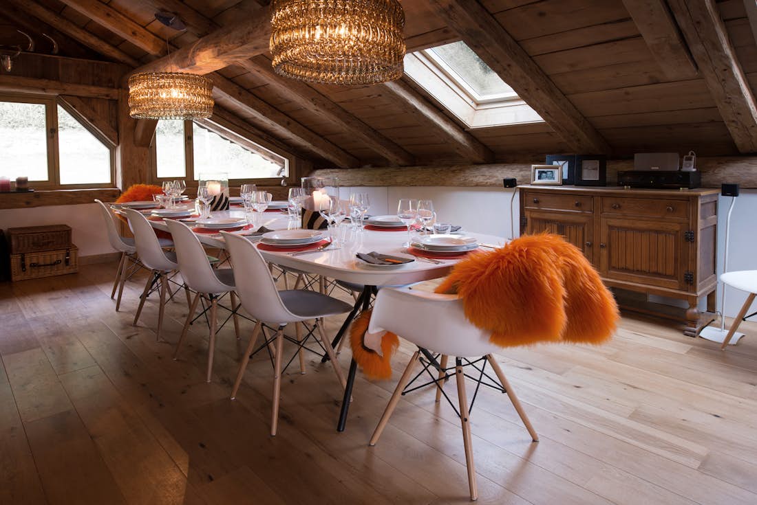 Cosy dining room with wooden ceiling luxury hot tub chalet La Ferme de Margot Morzine