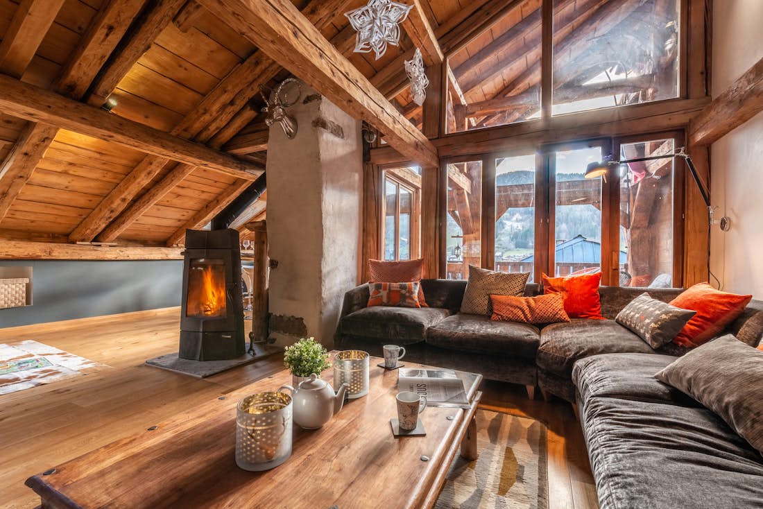 Spacious living room fireplace luxury hot tub chalet La Ferme de Margot Morzine