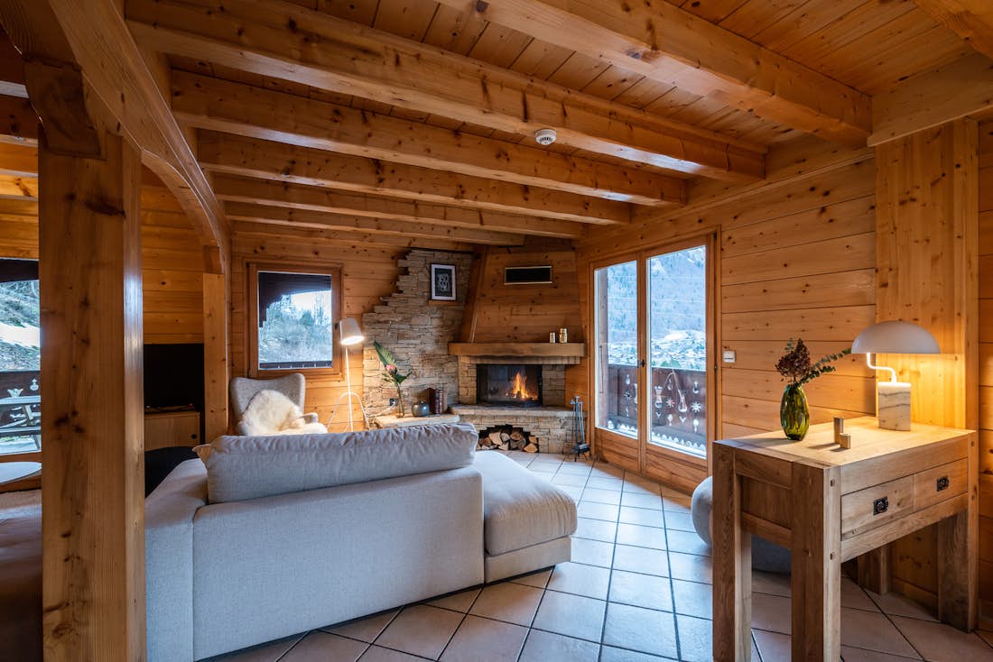 Alpine living room stoned fireplace luxury family chalet Doux-Abri Morzine