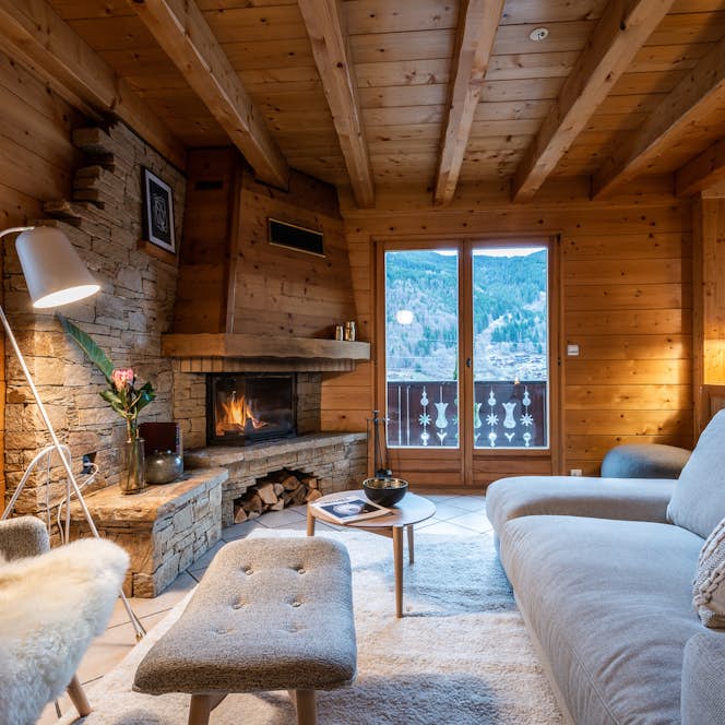Morzine accommodation - Chalet Doux Abri - Luxurious living room fireplace luxury family chalet Doux-Abri Morzine