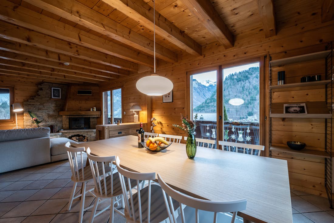 Morzine accommodation - Chalet Doux Abri - Open dining room and living room with mountain views luxury eco-friendly chalet Doux-Abri Morzine