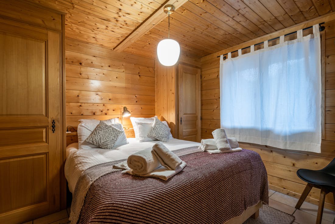 Morzine accommodation - Chalet Doux Abri - Cosy double bedroom with ample cupboard space and landscape views at hotel services chalet Doux-Abri Morzine