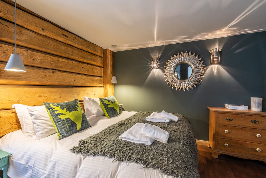 Morzine accommodation - La Ferme de Margot - Cosy double bedroom with ample cupboard space and landscape views at alps chalet La Ferme de Margot Morzine