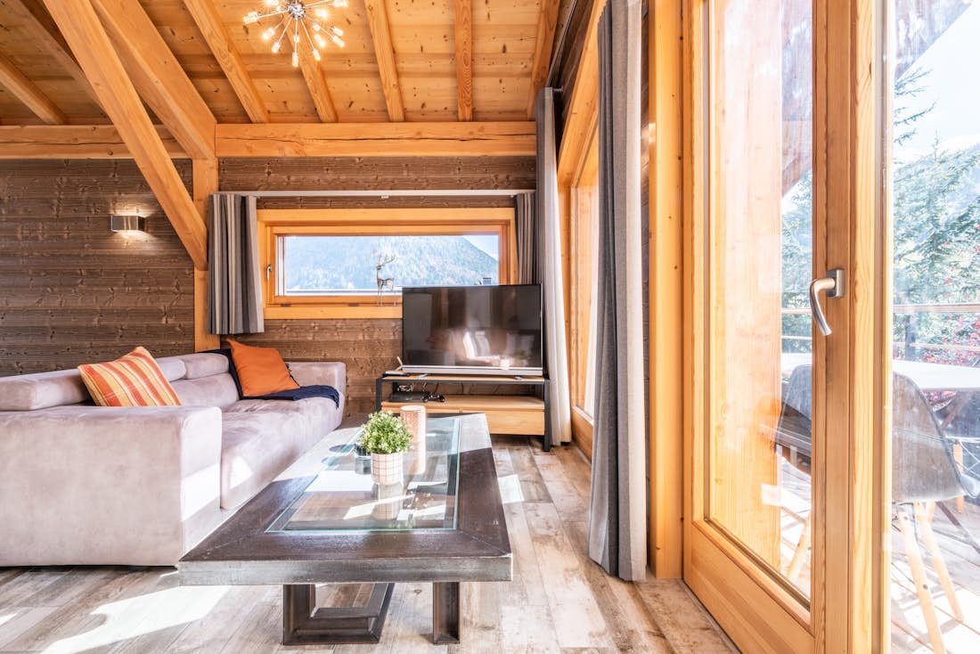 Morzine accommodation - Apartment Etoile - Modern living room with TV and mountain views  in luxury hot tub apartment Etoile Morzine