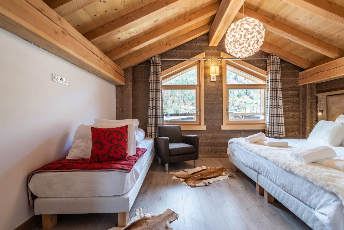 Morzine accommodation - Apartment Etoile - Contemporary double bedroom with an extra single bed and landscape views at eco-friendly apartment Etoile Morzine