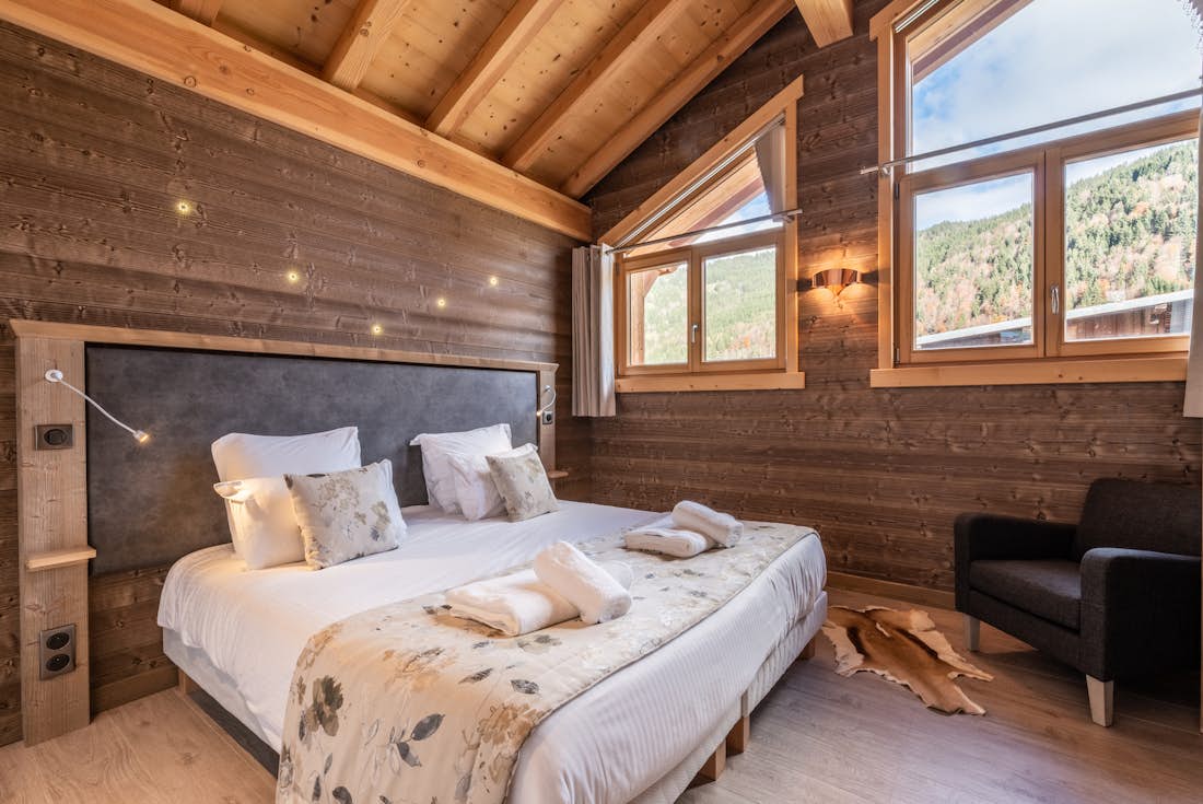 Morzine accommodation - Apartment Etoile - Spacious double bedroom with ample cupboard space and landscape views at alps apartment Etoile Morzine