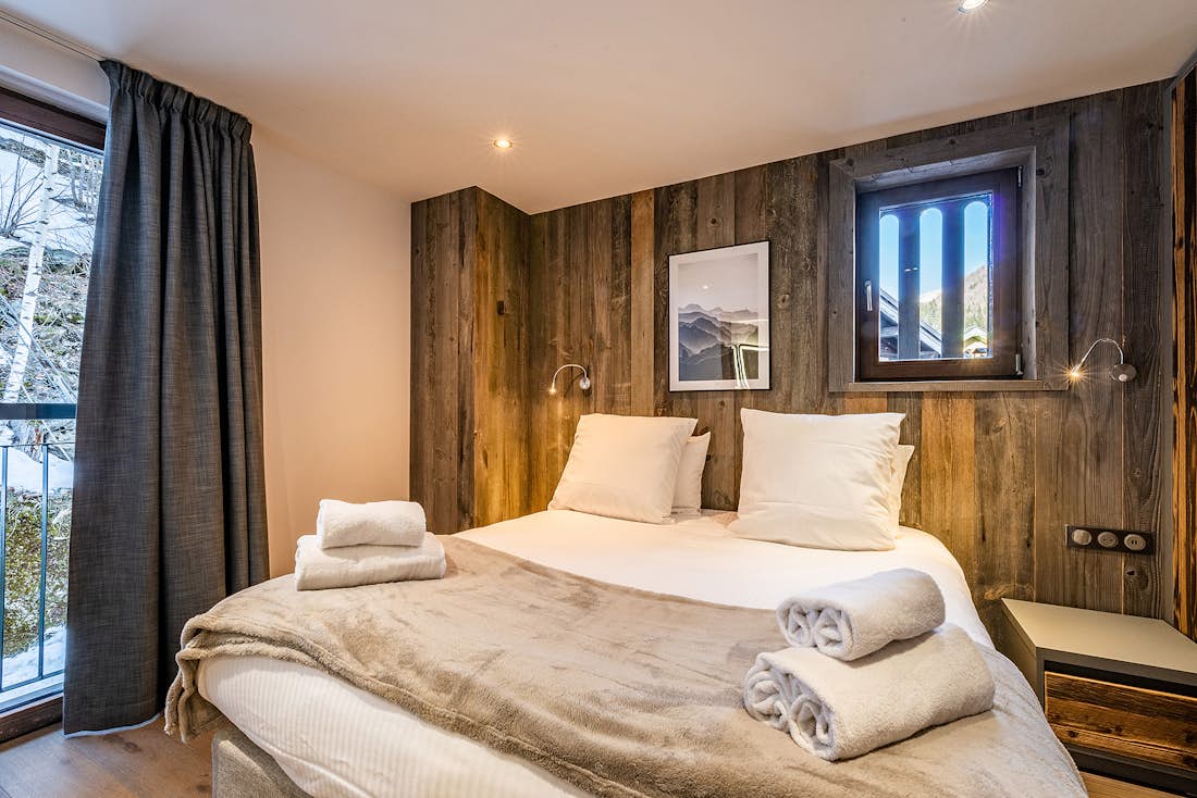 Chamonix accommodation - Chalet Douka - Cosy double bedroom with ample cupboard space and mountain views at ski Chalet Douka in Chamonix