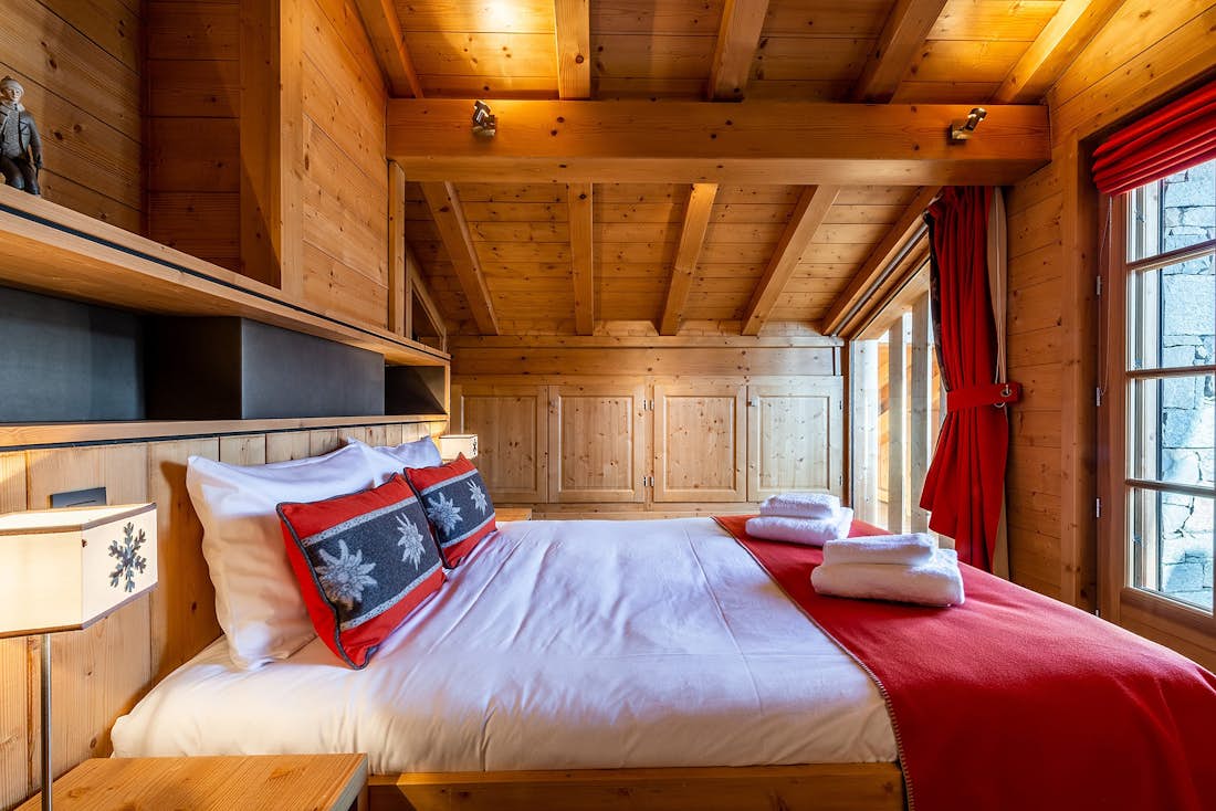 Les Gets accommodation - Chalet Abachi - Cosy double bedroom with ample cupboard space and mountain views at alps chalet Abachi in Les Gets