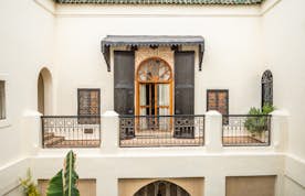 Traditional wooden black and brown Moroccan door at Adilah riad in Marrakech