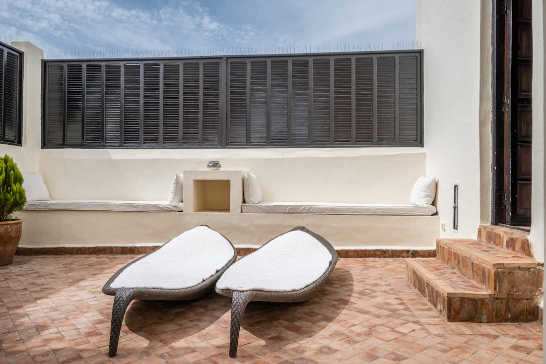 Terrace with lounging chairs at Adilah riad in Marrakech