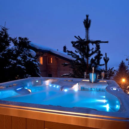 A hot tub with lights on top of it.