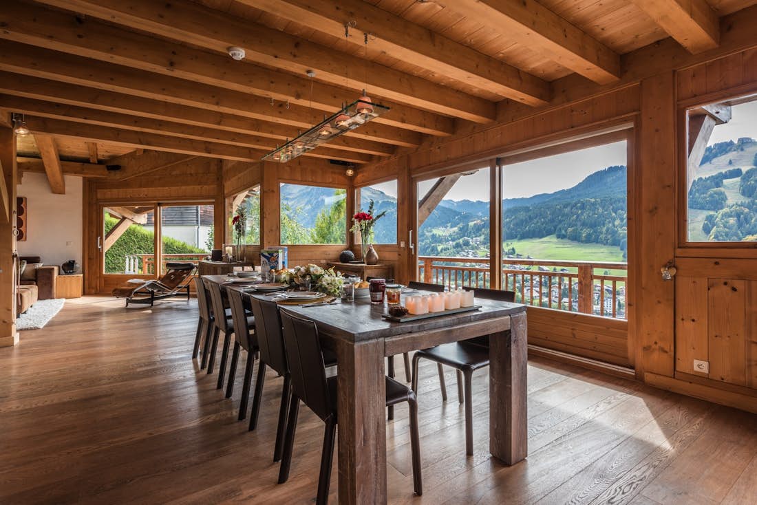 Large wooden dining table views French Alps eco-friendly chalet Omaroo I Morzine