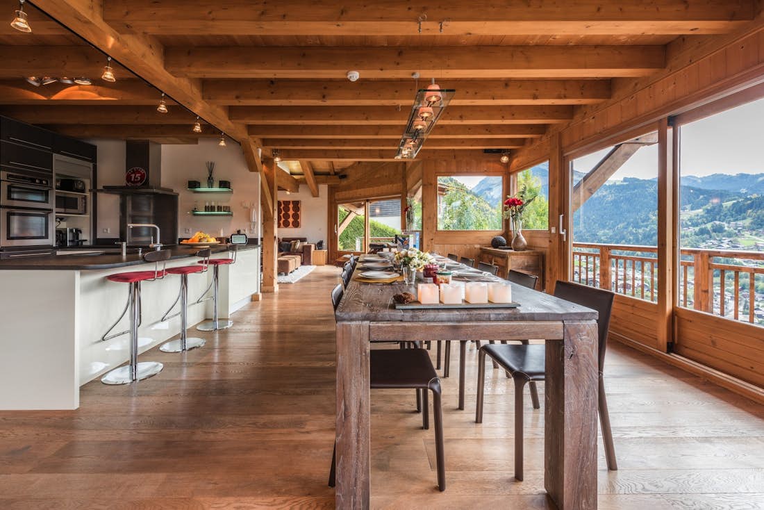Wooden dining table views Alps eco-friendly chalet Omaroo I Morzine