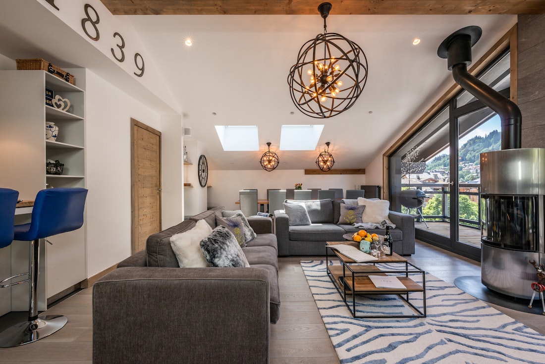 Spacious living room fireplace luxury family apartment Ozigo Les Gets