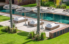 Private pool and raffia sun beds at Zagora private villa in Marrakech
