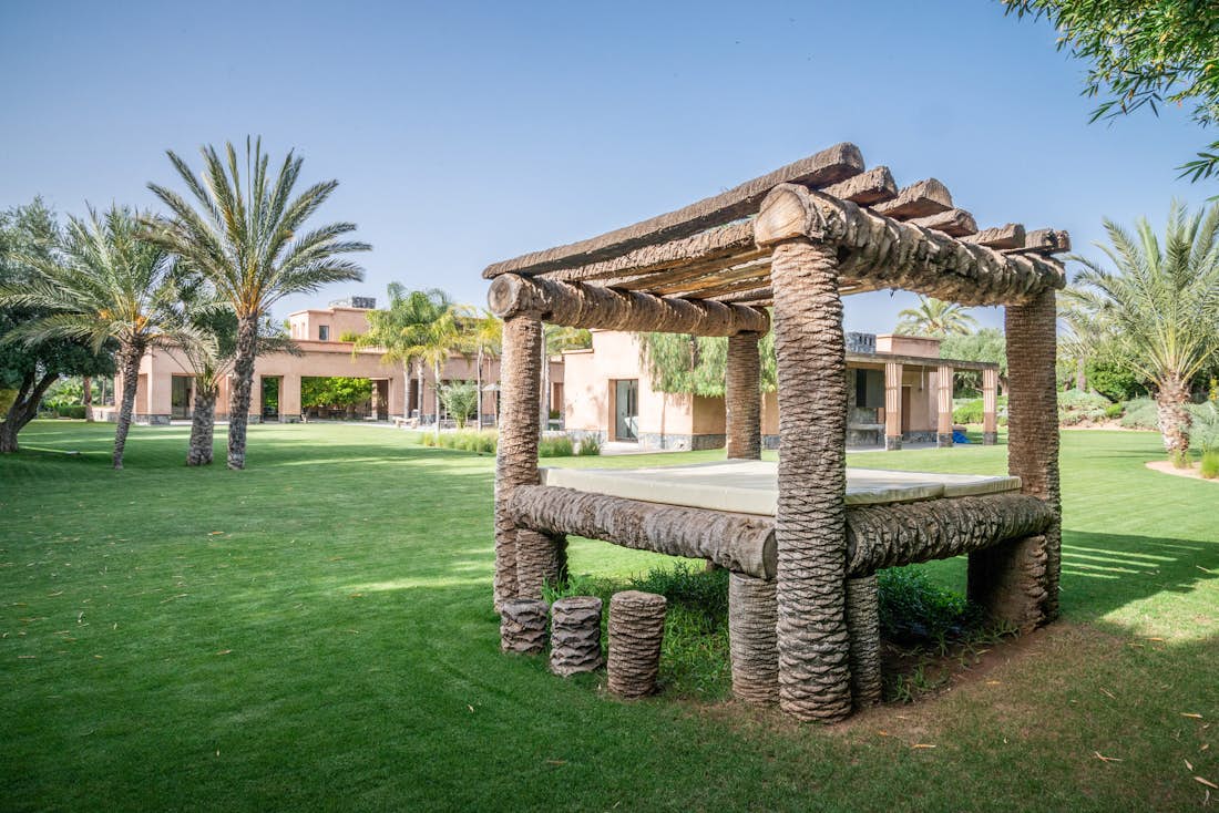 Private garden with outdoor daybed pergola at Marhba luxury private villa in Marrakech