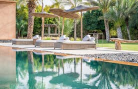 Marrakech accommodation - Villa Marhba - Private pool with raffia daybeds at Marhba luxury private villa in Marrakech