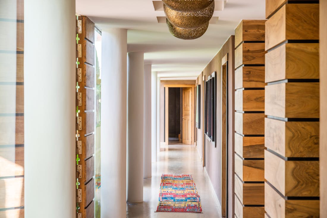 Real wood walls and Moroccan rugs at Zagora private villa in Marrakech