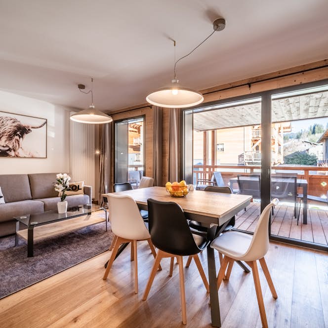 Les Gets - 1 Les Gets accommodation - Apartment Clematis - A living room with a dining table and chairs.