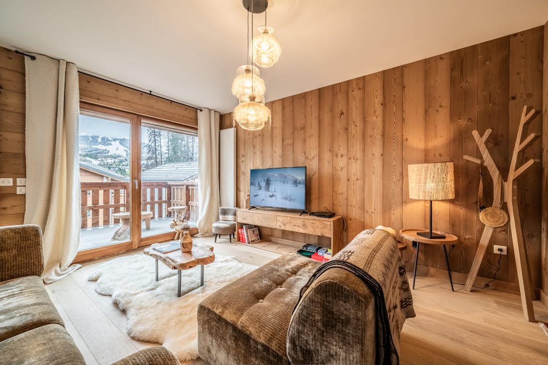 Megève location - Appartement Centaurea - Salon confortable dans le appartement Cortirion vues sur la montagne à Megève