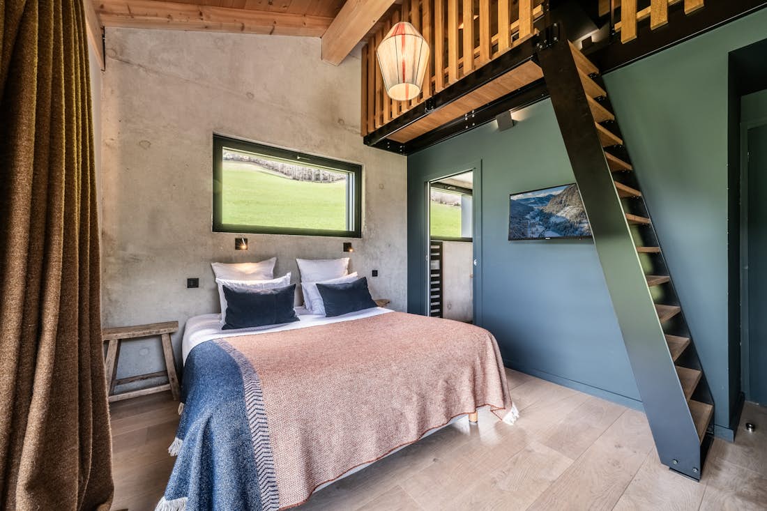 Morzine accommodation - Chalet Nelcôte - Cosy double bedroom with ample cupboard space and landscape views at eco-friendly chalet Nelcôte Morzine