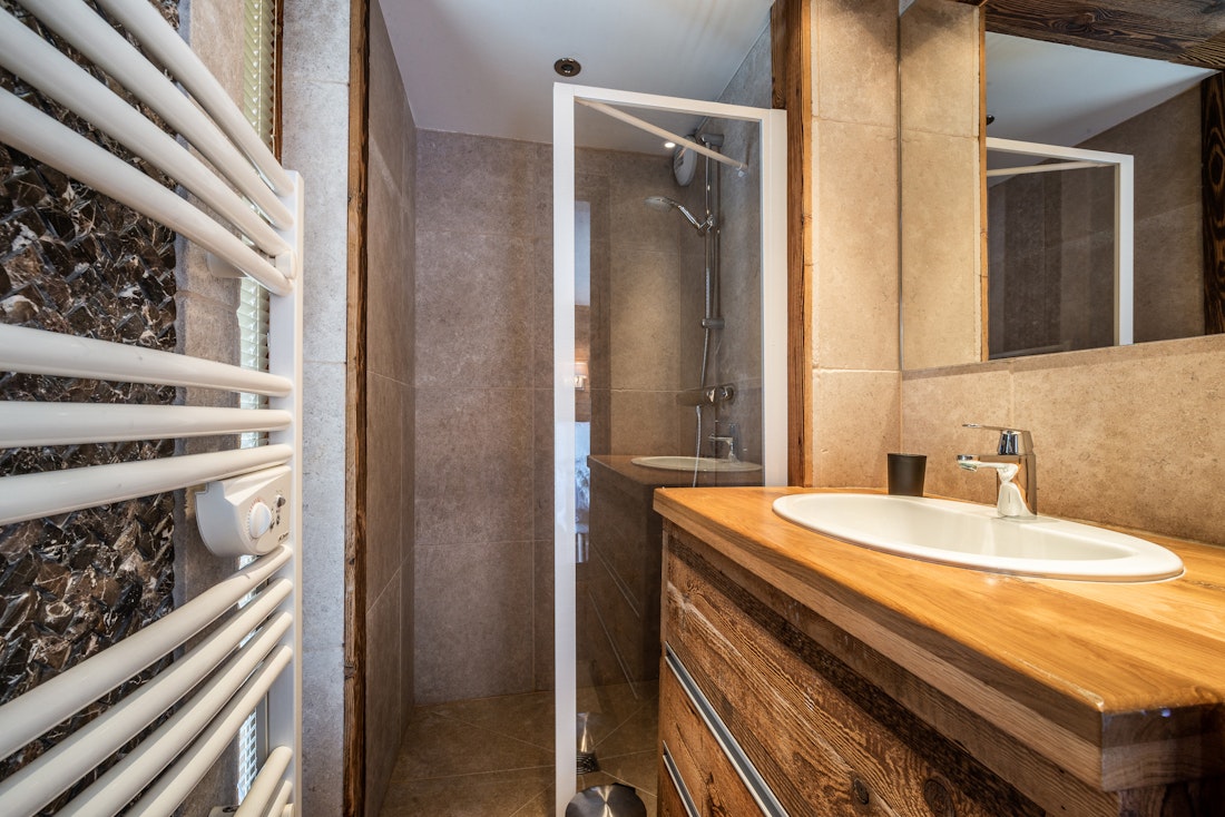 Modern bathroom walk-in shower ski in ski out apartment Moabi Courchevel Le Praz