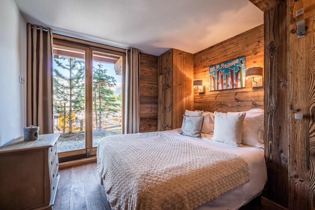 Cosy luxury double bedroom landscape views ski in ski out apartment Moabi Courchevel Le Praz