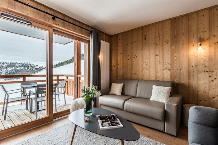 Alpine living room luxury ski in ski out apartment Thuja Alpe d'Huez