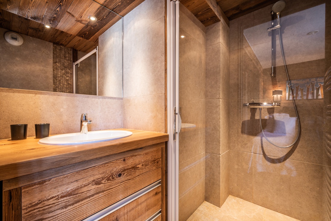 Luxury bathroom with walk-in shower at ski in ski out apartment Moabi Courchevel Le Praz