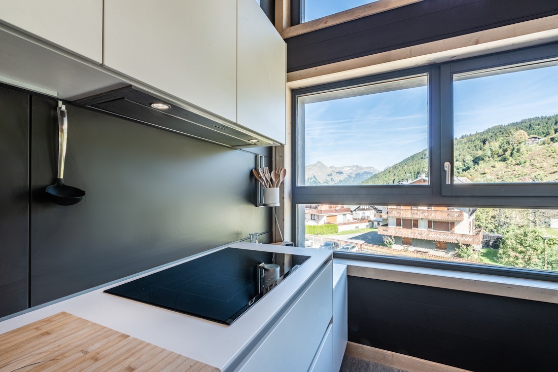 Comtemporary designed kitchen outdoor views ski in ski out apartment Merbau Les Gets