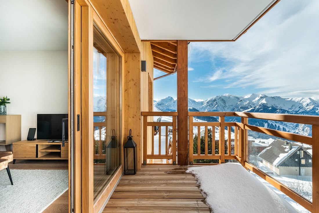 Alpe d’Huez location - Appartement Fagus - Une grande terrasse avec vue sur la montagne dans l'appartement de luxe Fagus à Alpe d'Huez