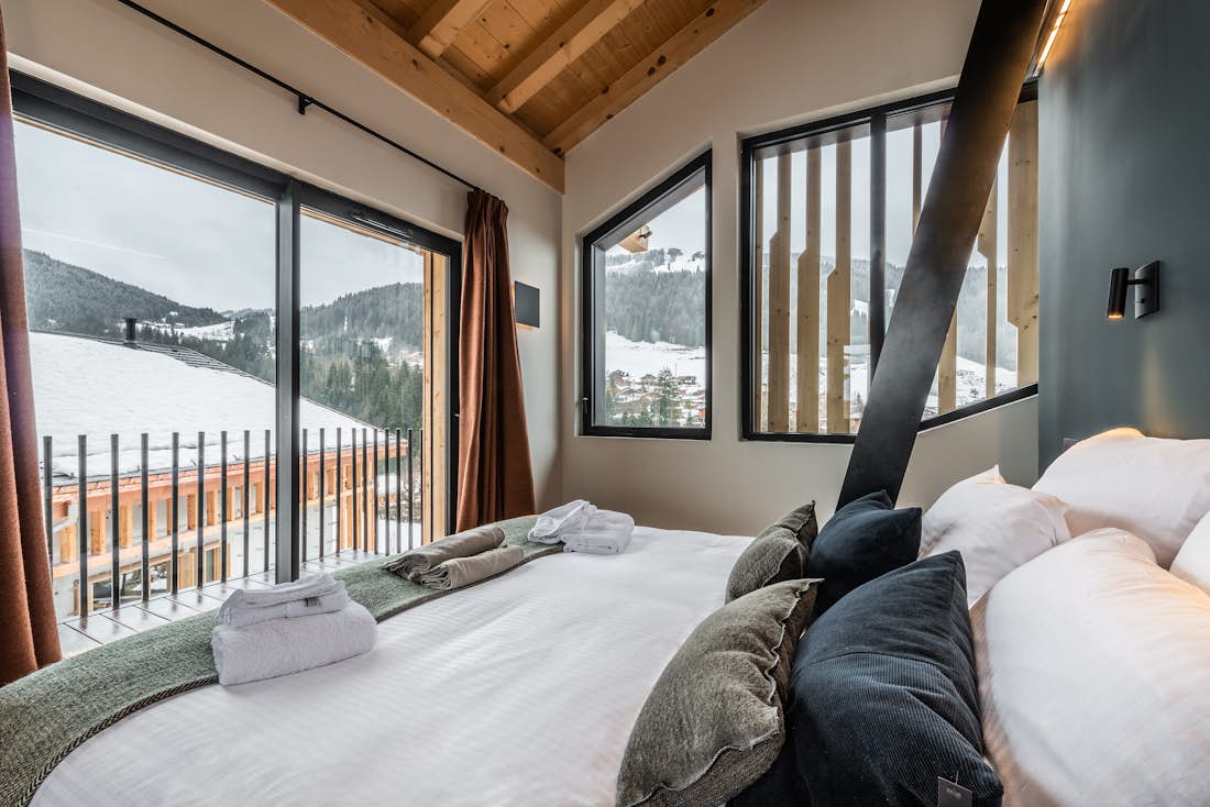 Luxury double ensuite bedroom mountain views eco-friendly chalet Nelcôte Morzine