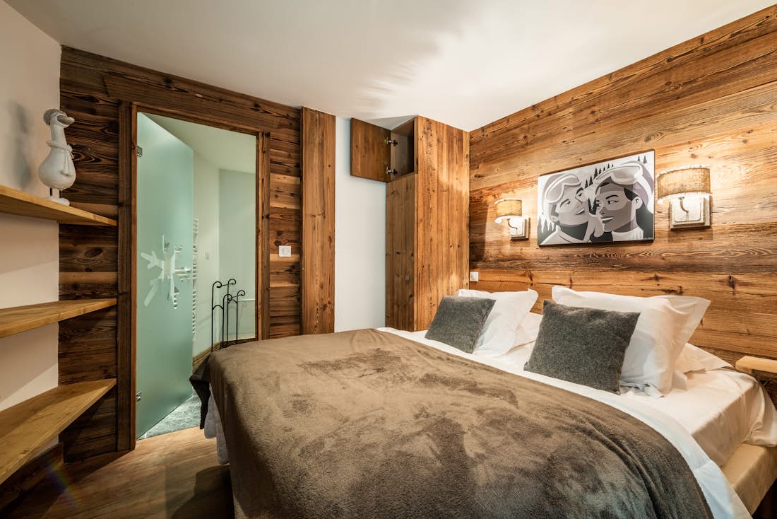 Luxury double ensuite bedroom mountain views ski in ski out apartment Moabi Courchevel Le Praz