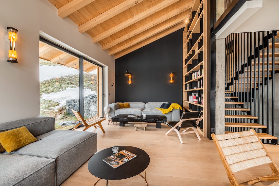 Morzine accommodation - Chalet Nelcote - Open plan living room with light grey sofas in luxury ski chalet chalet Nelcôte Morzine