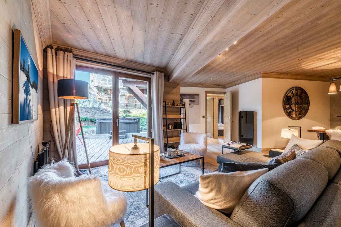 Spacious alpine living room outdoor views luxury ski in ski out apartment Padouk Courchevel Moriond