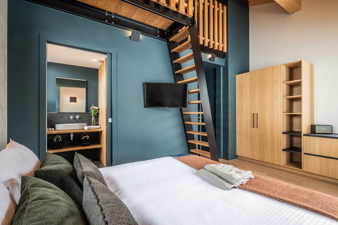 Morzine accommodation - Chalet Nelcote - Cosy double bedroom with ample cupboard space and landscape views at eco-friendly chalet Nelcôte Morzine