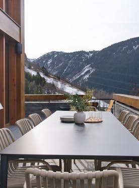 Baqueira - 5 Baqueira Beret location - Chalet Timok  - A wooden deck with a table and chairs.