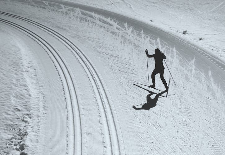 A person skiing down a snowy hill