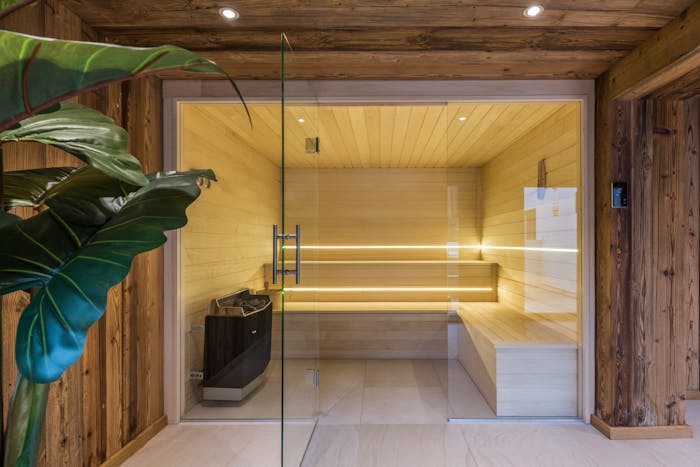 Sauna bois pierres chaudes appartement services hôteliers Kauri Morzine