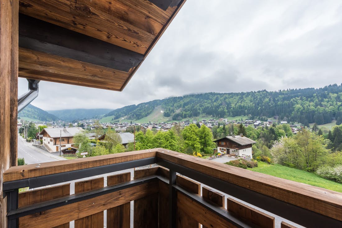 Morzine accommodation - Apartment Agba - A wooden terrace with mountain views over the Alps at the luxury family apartment Agba in Morzine