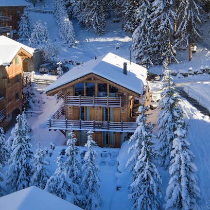 An aerial view of a ski chalet in the snow.