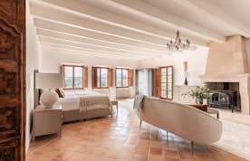 Mallorca accommodation - Can Tramuntana - A bedroom with a bed and a chair.
