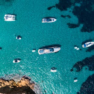 An aerial view of a group of boats in the water.