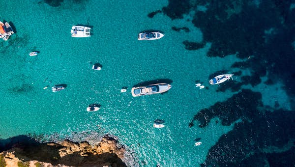 An aerial view of a group of boats in the water