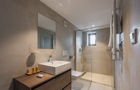 Modern bathroom walk-in shower ski apartment Sugi Morzine